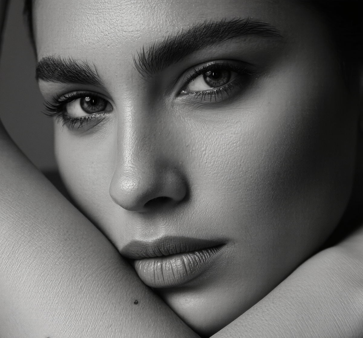 Close-up of a person's face with a soft focus on the background